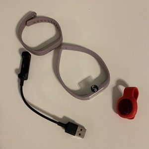 Fitbit Flex in grey lavender and Jawbone Up in red